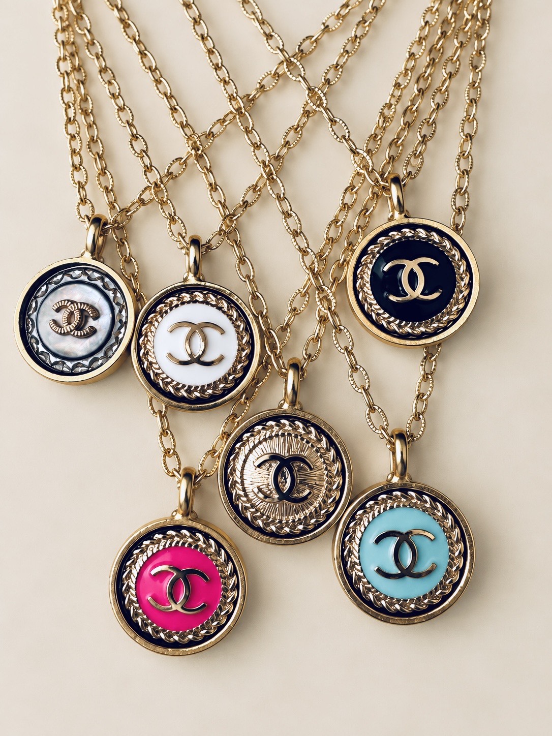Designer logo button necklaces in enamel and gold